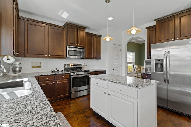 706 Airdale Ln, Simpsonville, SC 29680 - kitchen featuring stainless steel appliances, arched walkways, white cabinets, decorative backsplash, and recessed lighting