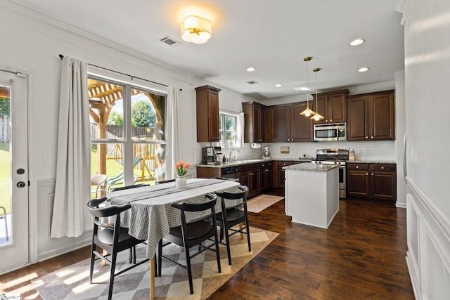 706 Airdale Ln, Simpsonville, SC 29680 - kitchen featuring appliances with stainless steel finishes, dark brown cabinets, backsplash, a kitchen island, and a sink