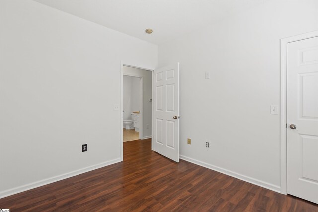 622 Mckenna Cir, Greenville, SC 29615 - unfurnished bedroom featuring dark wood-type flooring and baseboards