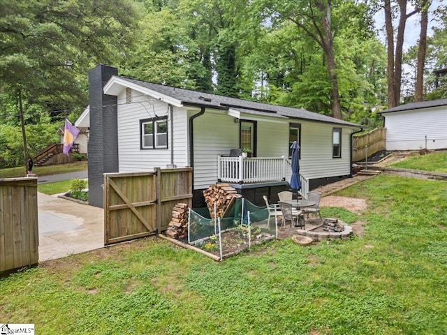 11 Christopher St, Greenville, SC 29617 - view of front of house featuring a chimney, stairway, view of scattered trees, and a patio area