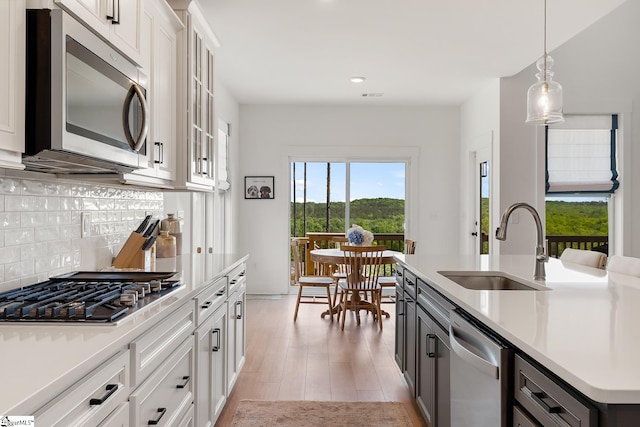 139 Ridgeline Row, Central, SC 29630 - kitchen featuring stainless steel appliances, a sink, decorative backsplash, recessed lighting, and light countertops