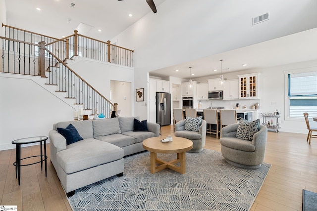 139 Ridgeline Row, Central, SC 29630 - living room featuring light wood-type flooring, a ceiling fan, stairs, recessed lighting, and high vaulted ceiling