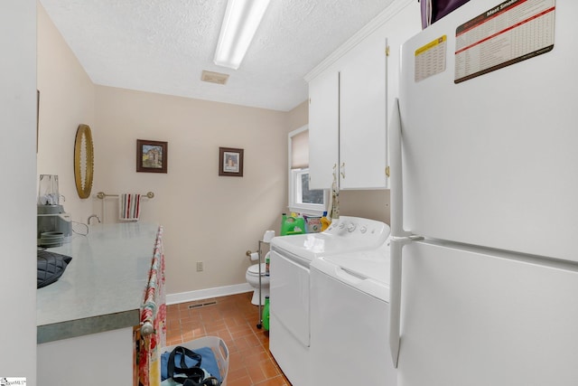 416 Ashley Downs, Anderson, SC 29621 - washroom with separate washer and dryer, a textured ceiling, baseboards, and tile patterned floors