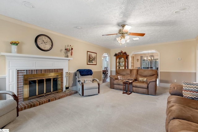 416 Ashley Downs, Anderson, SC 29621 - living area featuring arched walkways, a textured ceiling, ornamental molding, a ceiling fan, and carpet flooring
