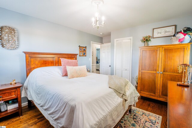 147 Daniel Dr, Easley, SC 29642 - bedroom with a closet, dark wood-style flooring, and a chandelier