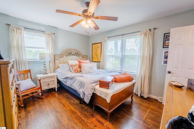 147 Daniel Dr, Easley, SC 29642 - bedroom with multiple windows, dark wood-type flooring, ceiling fan, and baseboards