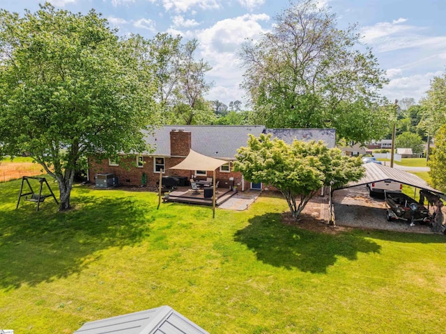 147 Daniel Dr, Easley, SC 29642 - back of property with a chimney, a yard, a deck, and brick siding