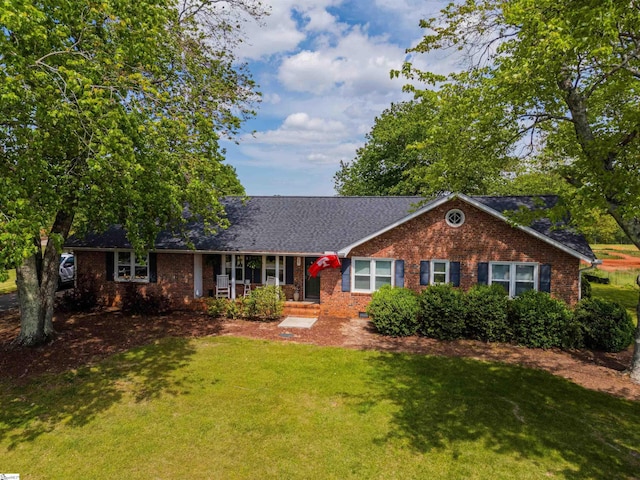 147 Daniel Dr, Easley, SC 29642 - single story home featuring a front yard, a porch, and brick siding