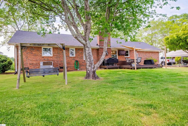 147 Daniel Dr, Easley, SC 29642 - rear view of house with a lawn, brick siding, and a wooden deck