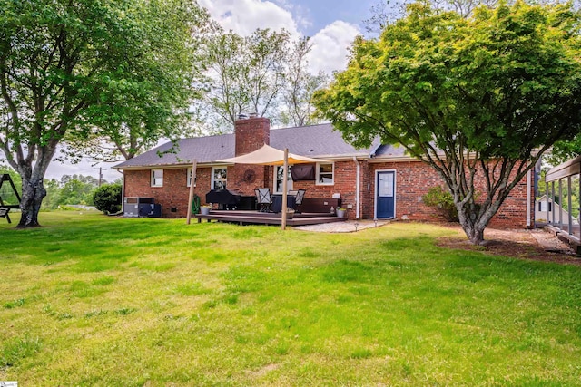 147 Daniel Dr, Easley, SC 29642 - rear view of property featuring a deck, a yard, brick siding, and a chimney