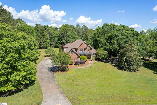view from above of property featuring a heavily wooded area