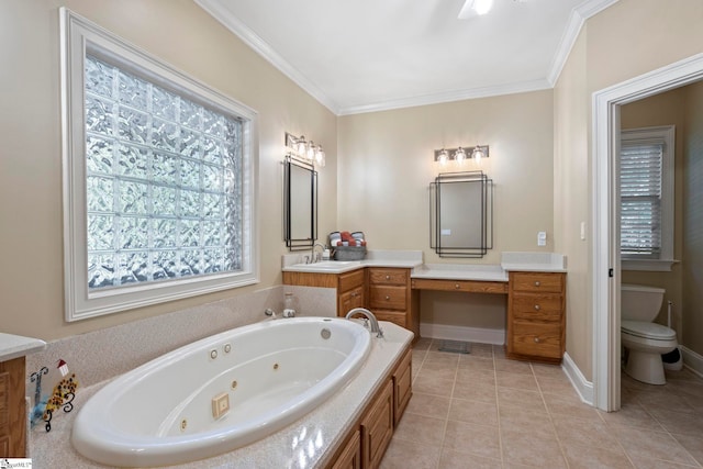 bathroom with a whirlpool tub, vanity, tile patterned flooring, toilet, and crown molding
