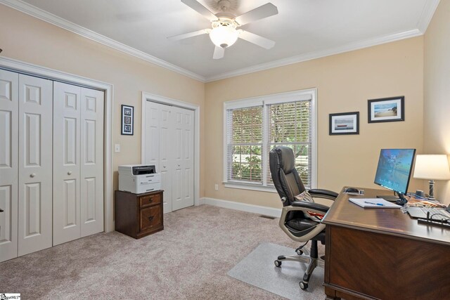 home office featuring carpet flooring, crown molding, a ceiling fan, and baseboards