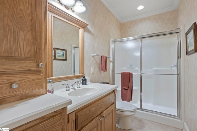 bathroom with ornamental molding, a stall shower, vanity, tile patterned floors, and toilet