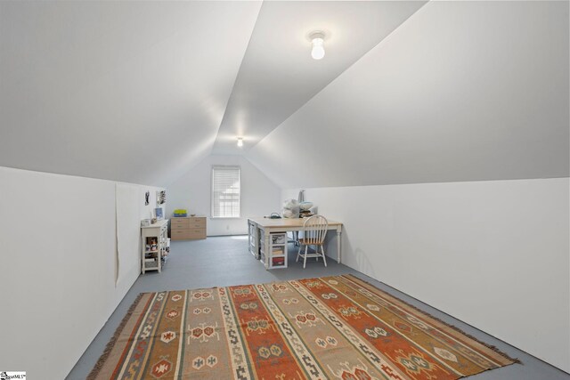 additional living space with lofted ceiling and carpet