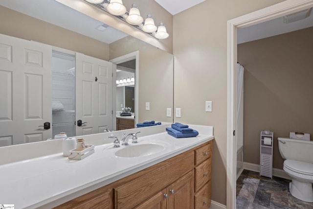 bathroom featuring toilet, vanity, baseboards, and a shower with shower curtain
