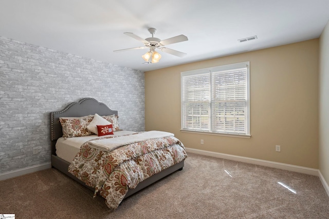 bedroom with baseboards, carpet floors, and a ceiling fan
