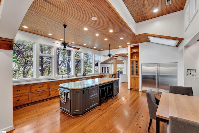 kitchen featuring stainless steel built in refrigerator, wood ceiling, a ceiling fan, light wood-style flooring, and recessed lighting