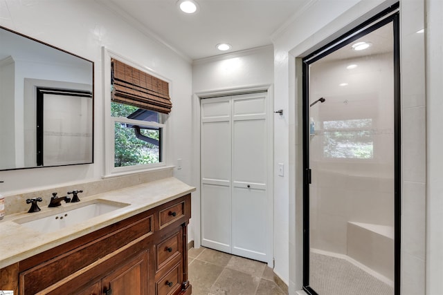 bathroom with a shower stall, crown molding, vanity, and recessed lighting