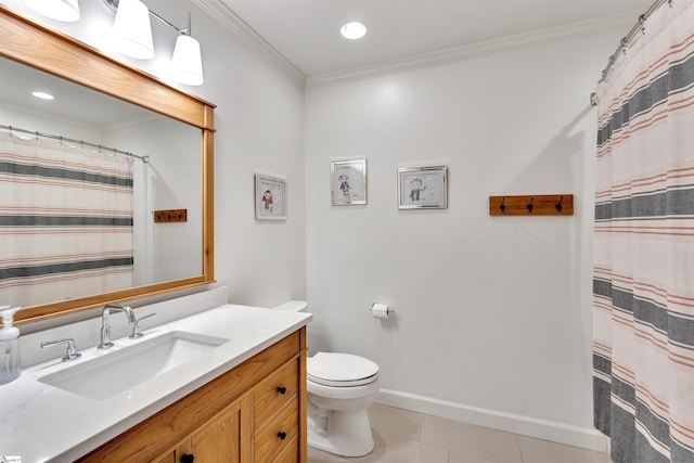 bathroom with tile patterned floors, toilet, crown molding, vanity, and baseboards