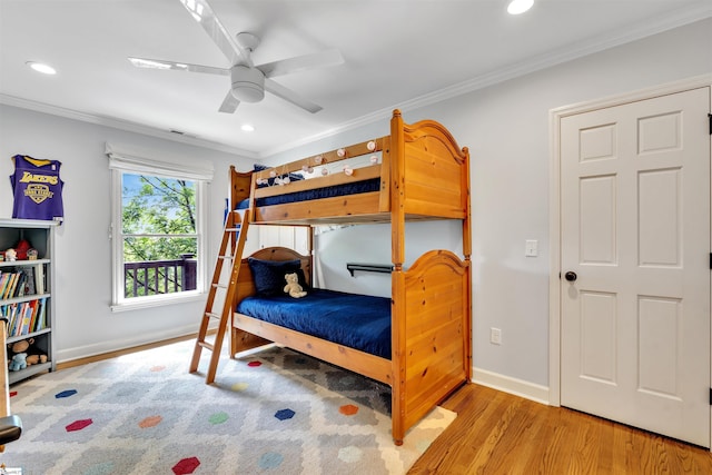 bedroom featuring crown molding, wood finished floors, recessed lighting, baseboards, and ceiling fan