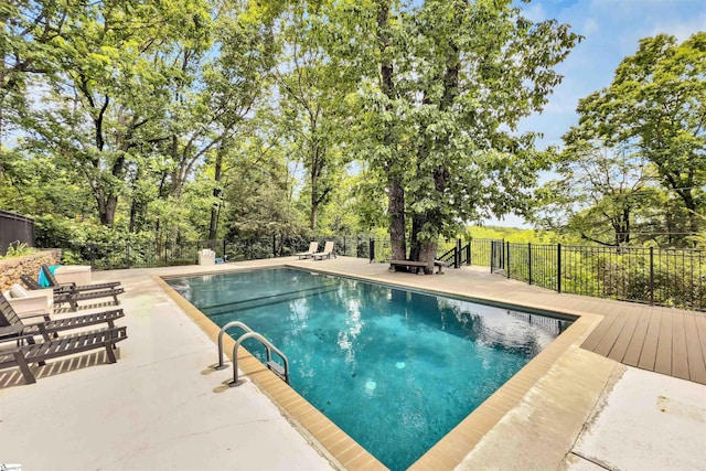 view of pool featuring fence and a patio area