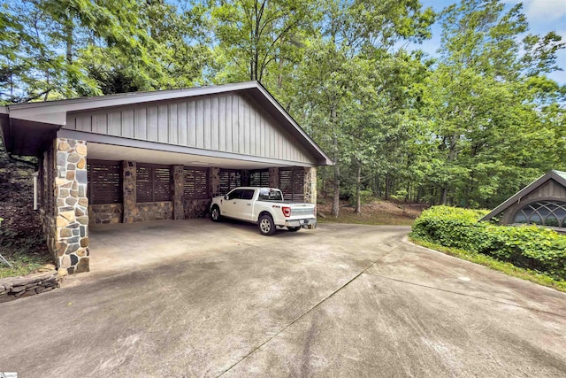 view of parking / parking lot featuring driveway and a carport