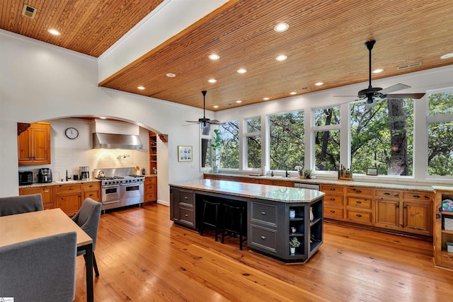 kitchen featuring a ceiling fan, stainless steel appliances, wood ceiling, open shelves, and a sink