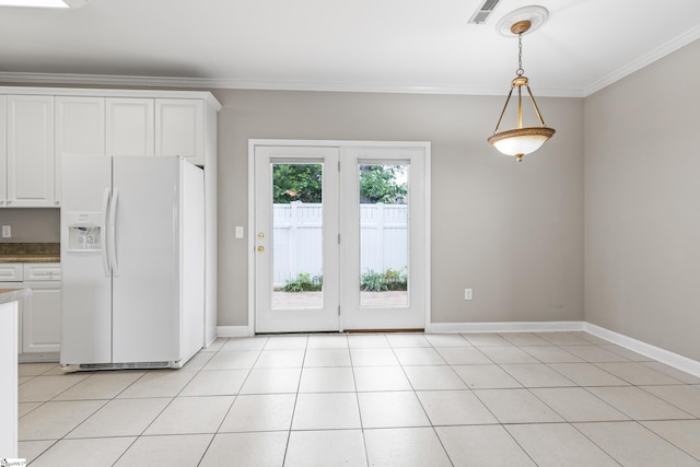 46 Ridgestone Cir, Mauldin, SC 29662 - kitchen with white refrigerator with ice dispenser, crown molding, baseboards, white cabinetry, and hanging light fixtures