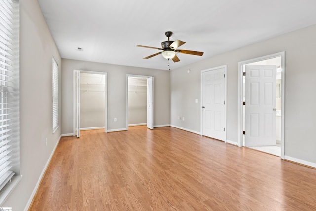46 Ridgestone Cir, Mauldin, SC 29662 - unfurnished bedroom with multiple closets, light wood-type flooring, baseboards, and ceiling fan