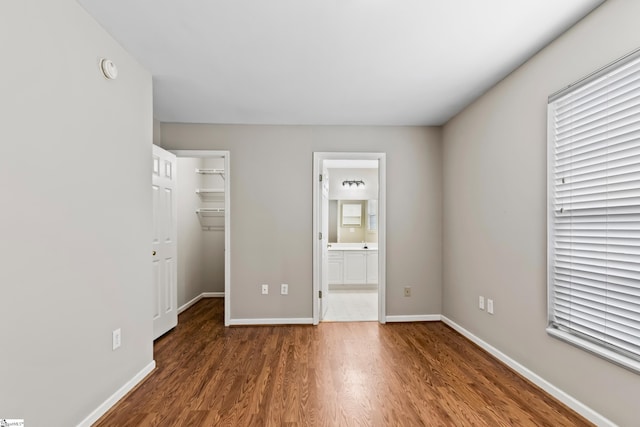46 Ridgestone Cir, Mauldin, SC 29662 - unfurnished bedroom featuring wood finished floors, a spacious closet, baseboards, and a closet