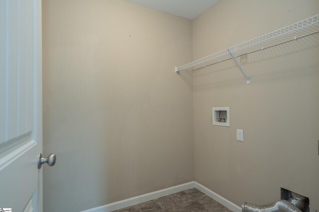 laundry area with baseboards and hookup for a washing machine