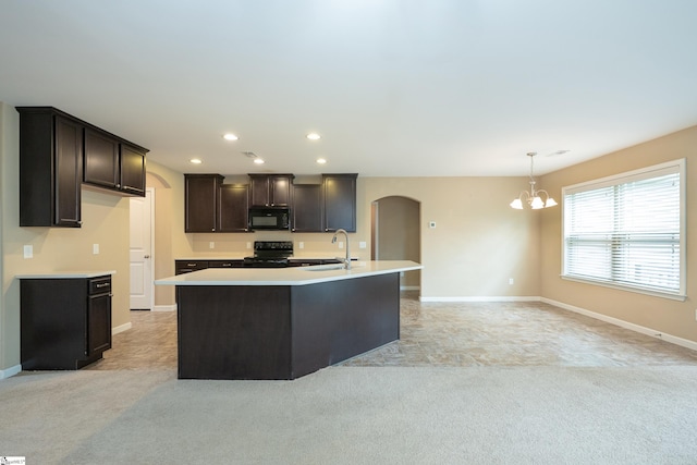 kitchen with black appliances, arched walkways, a chandelier, light colored carpet, and dark brown cabinets