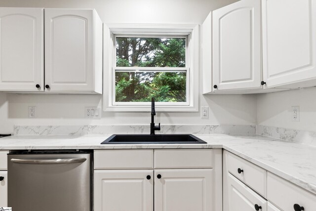 421 Wood Rd, Taylors, SC 29687 - kitchen featuring stainless steel dishwasher, a sink, white cabinetry, and light stone counters