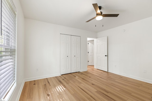 421 Wood Rd, Taylors, SC 29687 - unfurnished bedroom with light wood-style flooring, baseboards, a closet, and ceiling fan