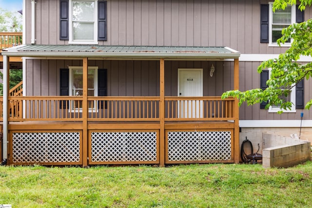 421 Wood Rd, Taylors, SC 29687 - rear view of house featuring a yard, a porch, metal roof, and board and batten siding
