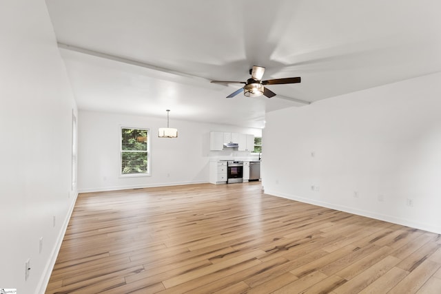 421 Wood Rd, Taylors, SC 29687 - unfurnished living room with a chandelier, light wood finished floors, a ceiling fan, and baseboards