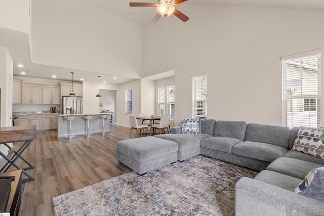 201 Rosecroft Dr, Easley, SC 29642 - living area featuring ceiling fan, a towering ceiling, light wood-style flooring, recessed lighting, and baseboards