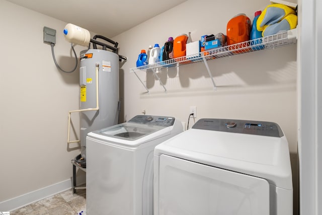 201 Rosecroft Dr, Easley, SC 29642 - clothes washing area with washer and clothes dryer, baseboards, and water heater