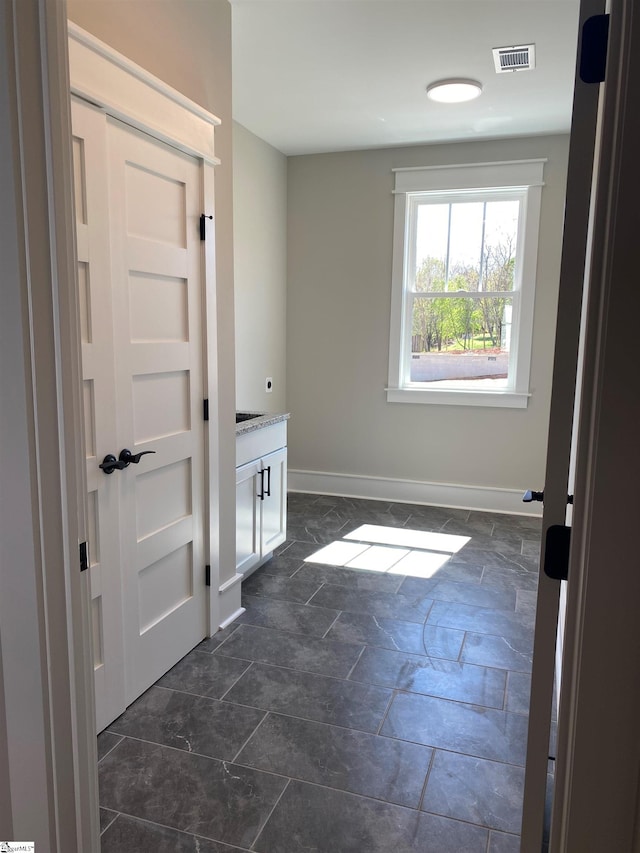 empty room featuring baseboards