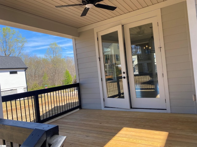 wooden terrace featuring a ceiling fan