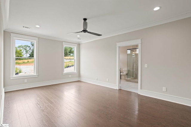 empty room with plenty of natural light, crown molding, ceiling fan, wood finished floors, and recessed lighting