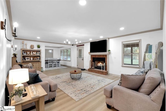 118 Briar Patch Rd, Anderson, SC 29621 - living room with light wood-type flooring, a chandelier, recessed lighting, a brick fireplace, and crown molding