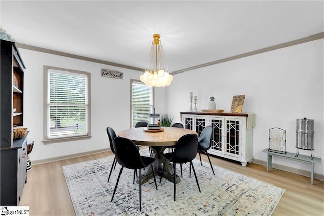 118 Briar Patch Rd, Anderson, SC 29621 - dining room with crown molding, a chandelier, light wood-type flooring, and baseboards