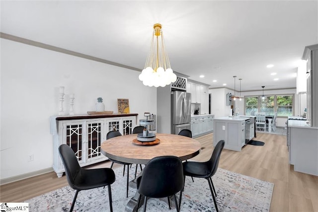 118 Briar Patch Rd, Anderson, SC 29621 - dining space with light wood finished floors, a chandelier, recessed lighting, ornamental molding, and baseboards