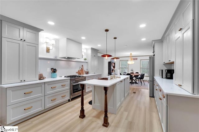 118 Briar Patch Rd, Anderson, SC 29621 - kitchen with gray cabinets, stainless steel appliances, a kitchen island with sink, light wood-style flooring, and recessed lighting