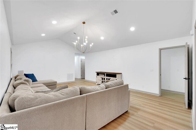 118 Briar Patch Rd, Anderson, SC 29621 - living area featuring a chandelier, light wood-style floors, recessed lighting, lofted ceiling, and baseboards