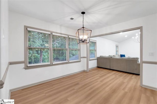 118 Briar Patch Rd, Anderson, SC 29621 - unfurnished dining area featuring a chandelier, light wood-style floors, healthy amount of natural light, and baseboards