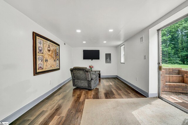 sitting room with recessed lighting, wood finished floors, and baseboards