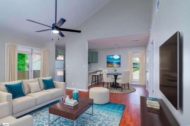 living area with high vaulted ceiling, a ceiling fan, wood finished floors, and baseboards
